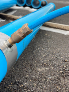 LYNX-PEX pipe attached to watermain with saddle